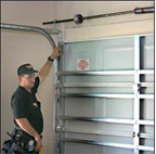 garage door repair man photo repairing a garage door in sacramento